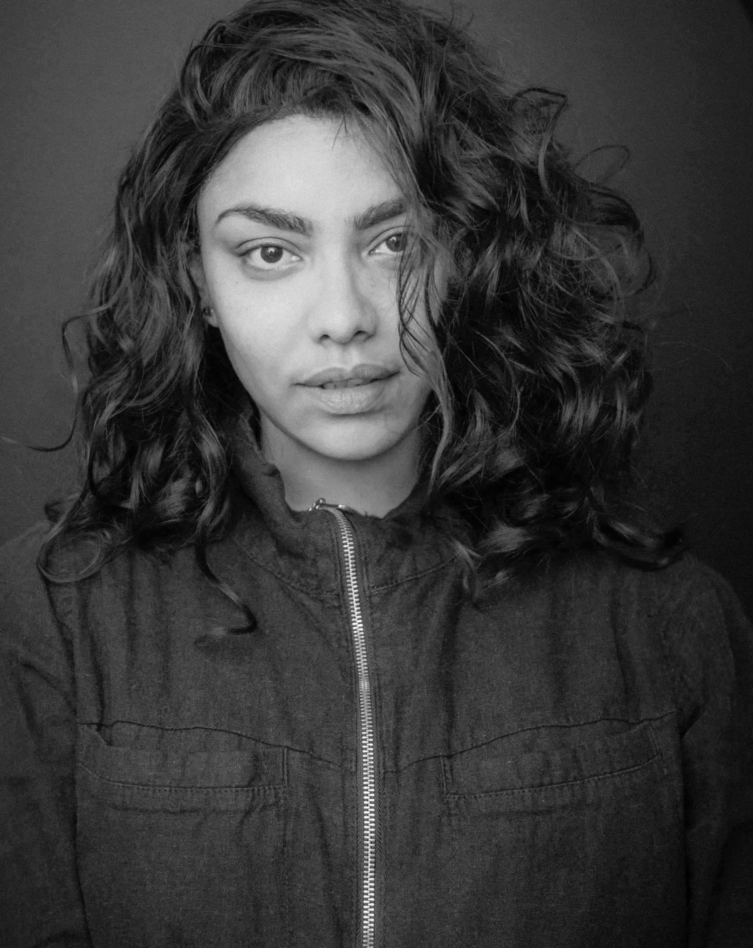 A black-and-white photo of Rose Ferreira, who studies planetary science and astronomy at Arizona State University.