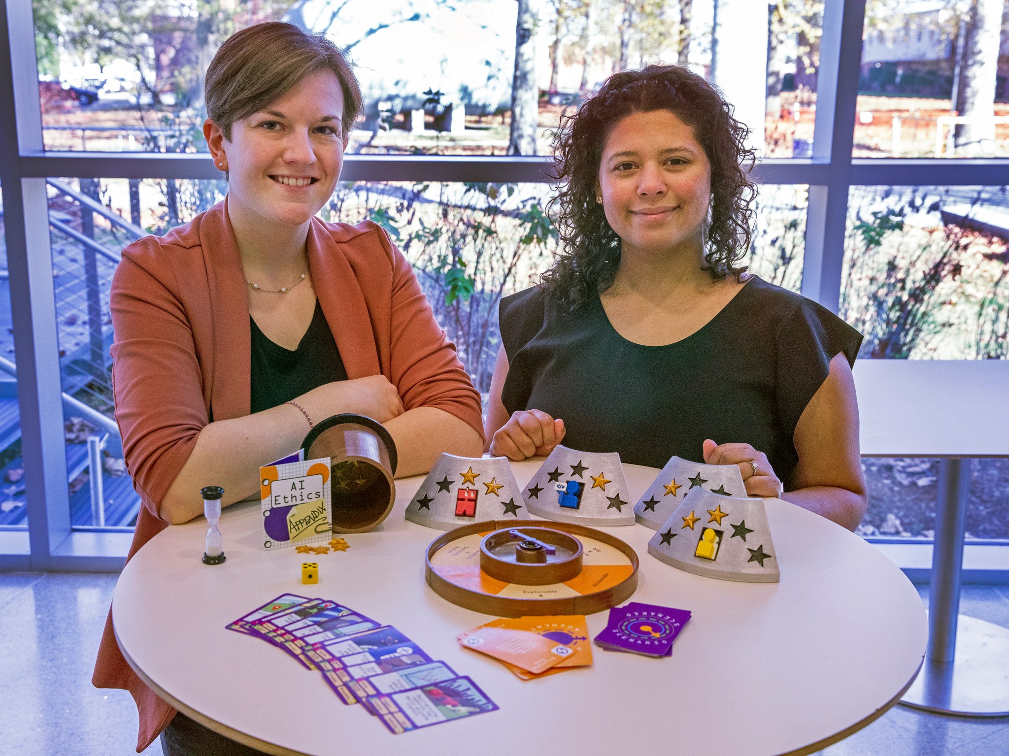 Jessica Robinson, left, and Cristina Morales Mojica developed a prototype that uses interactive gameplay to encourage users to think carefully and ethically about the decisions made with AI.