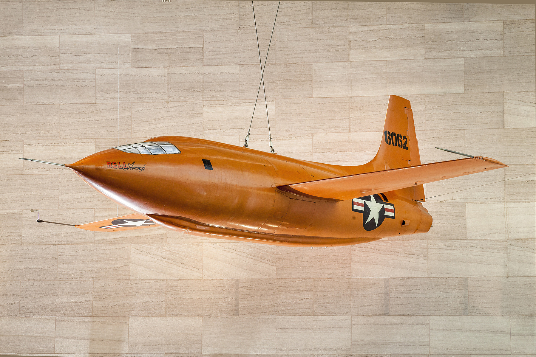 The Bell X-1 suspended from the ceiling of the National Air and Space Museum's main gallery in Washington, DC.