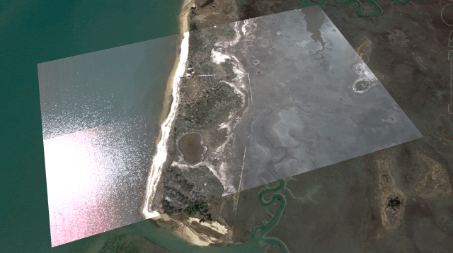 A shiny reflective layer overlays a satellite image of marshland.