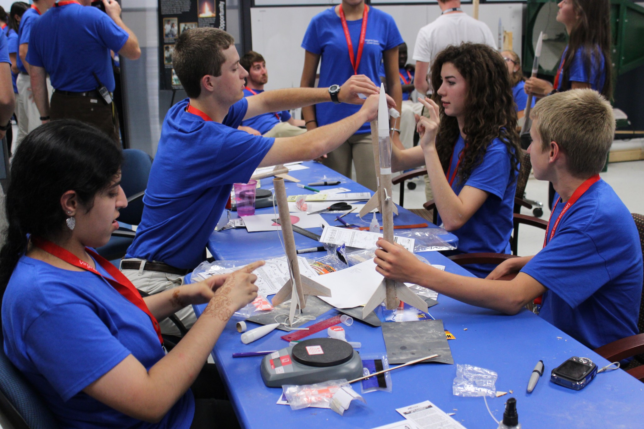 Students work together to build a model rocket