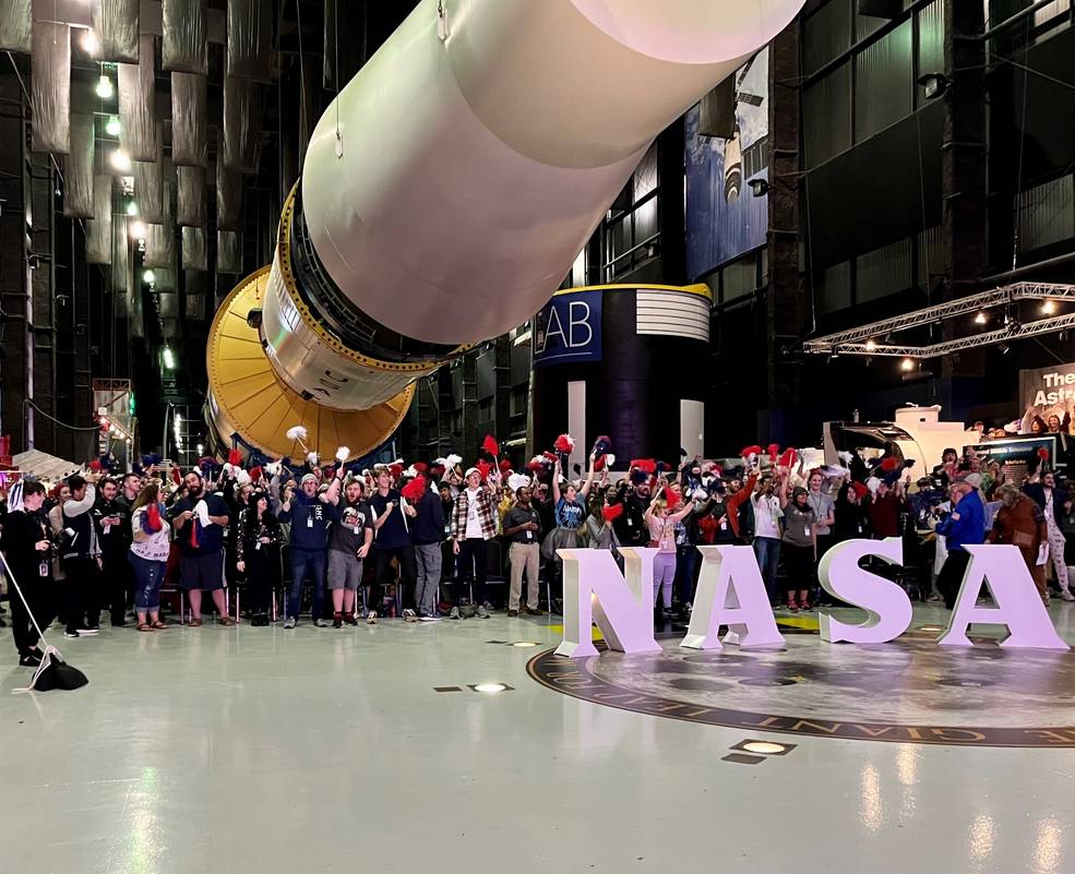 A crowd gathered for an Artemis I watch party at the U.S. Space u0026amp; Rocket Center in Huntsville roars with excitement while waiting for SLS to lift off. 