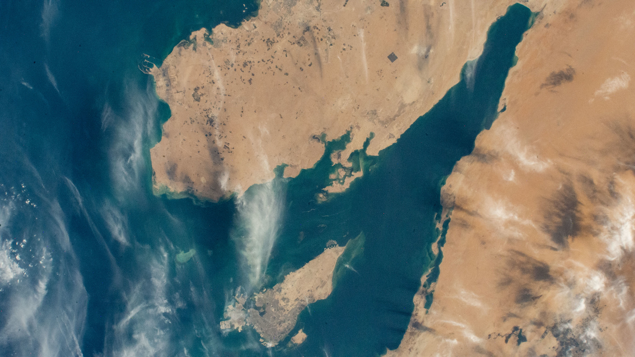 image of Qatar, Bahrain, and the eastern coast of Saudi Arabia on the Persian Gulf as seen from the International Space Station as it orbits above the Arabian Peninsula. 