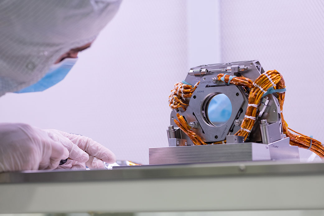 An engineer examines the fast steering mirror