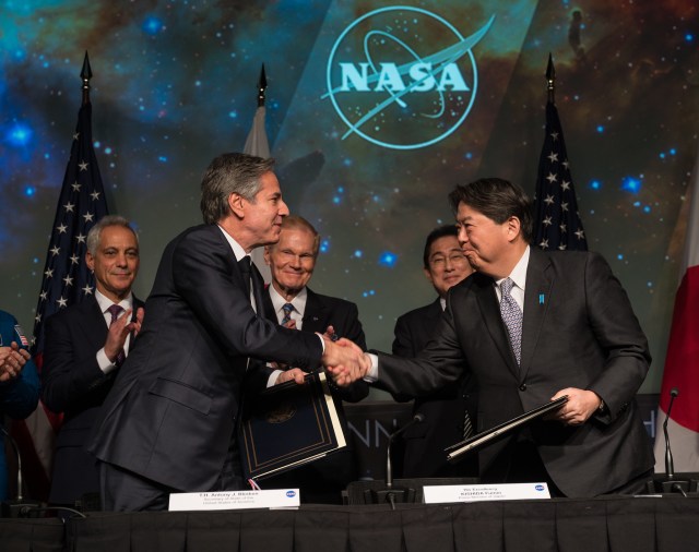 U.S. Secretary of State Antony Blinken, front left, and Japan’s Minister for Foreign Affairs, Hayashi Yoshimasa, front right, shake hands after signing an agreement that builds on a long history of collaboration in space exploration between the U.S. and Japan, Friday, Jan. 13, 2023, at the Mary W. Jackson NASA Headquarters building in Washington. Also present were U.S. Ambassador to Japan Rahm Emanuel, left, NASA Administrator Bill Nelson, second from left, and Prime Minister of Japan, His Excellency Kishida Fumio, right.