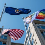 The Pride Progress Flag is seen waving in the wind at the Mary W. Jackson NASA Headquarters building in Washington.