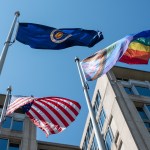 The Pride Progress Flag is seen waving in the wind at the Mary W. Jackson NASA Headquarters building in Washington.
