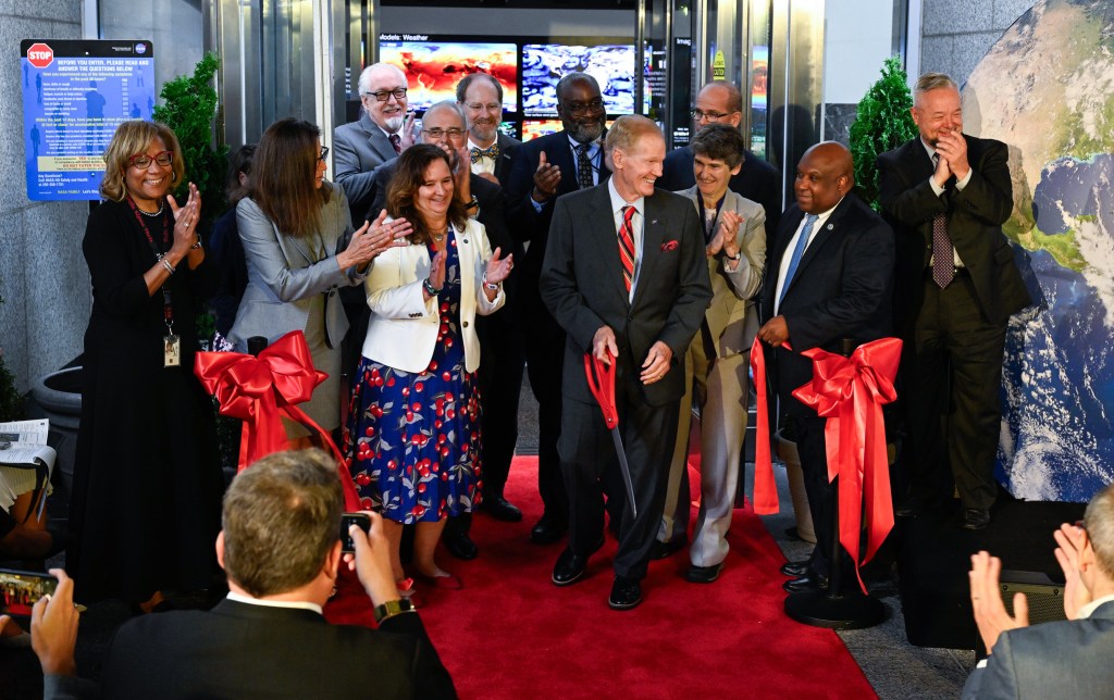 NASA Administrator Bill Nelson, center, cuts the ribbon to open NASA’s Earth Information Center alongside agency leadership and leadership from NOAA, USGS, USDA, USAID, EPA, and FEMA, Wednesday, June 21, 2023, at the Mary W. Jackson NASA Headquarters building in Washington.