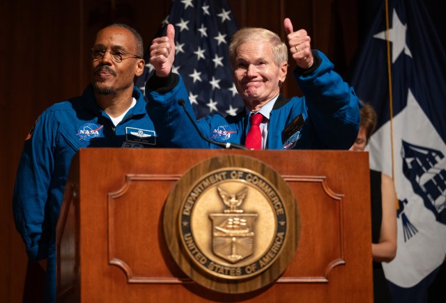 NASA Administrator Bill Nelson, right, gives thumbs up to students and attendees after delivering remarks alongside NASA astronaut Alvin Drew at the 2023 National Youth Summit.