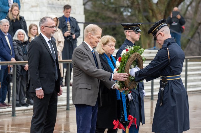 From left to right, NASA Associate Administrator Jim Free, NASA Administrator Bill Nelson and NASA Deputy Administrator Pam Melroy are seen during a wreath laying ceremony, as a part of NASA's Day of Remembrance, Thursday, Jan. 25, 2024, at Arlington National Cemetery in Arlington, Va.