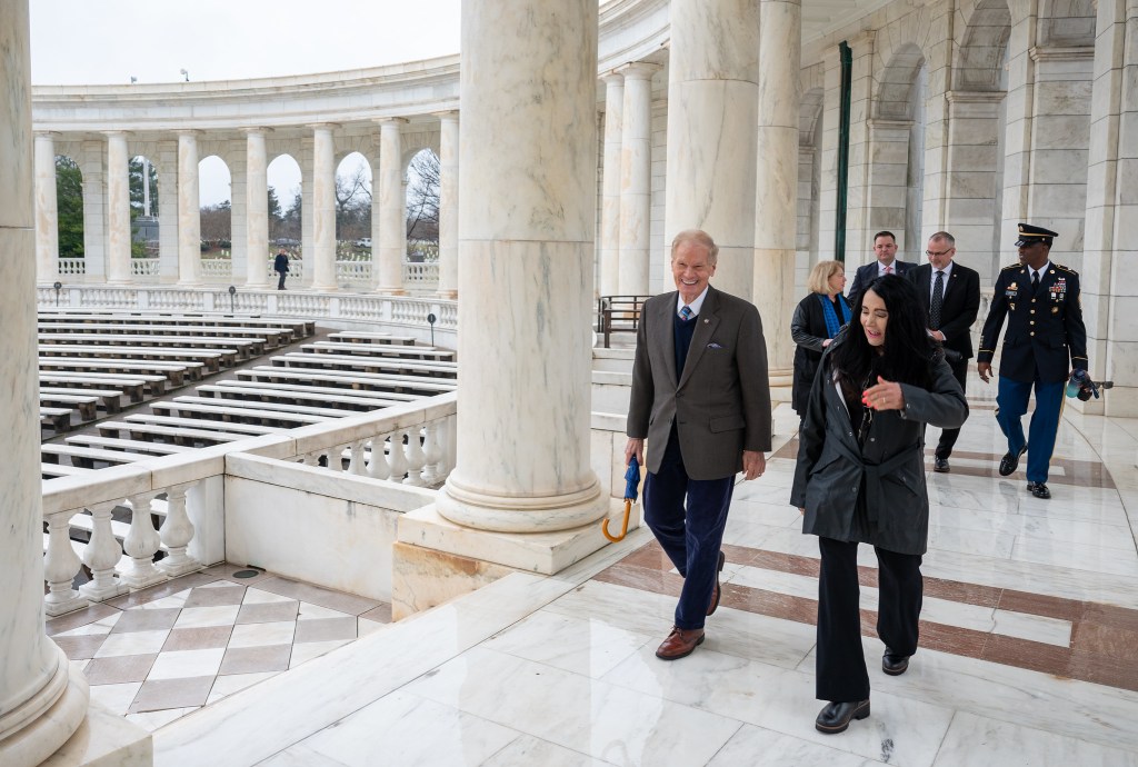 NASA Administrator Bill Nelson is escorted to the Tomb of the Unknowns for a wreath laying ceremony by Executive Director of the Office of Army Cemeteries, Karen Durham-Aguilera, as part of NASA's Day of Remembrance, Thursday, Jan. 25, 2024, at Arlington National Cemetery in Arlington, Va. The wreaths were laid in memory of those men and women who lost their lives in the quest for space exploration.