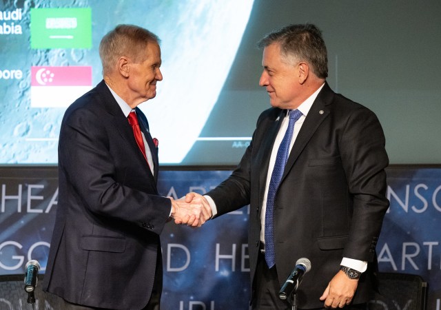 Administrator Bill Nelson, left, shakes hands with Uruguayan Foreign Minister Omar Pagani, right, during an Artemis Accords signing ceremony, Thursday, Feb. 15, 2024, at the Mary W. Jackson NASA Headquarters building in Washington.