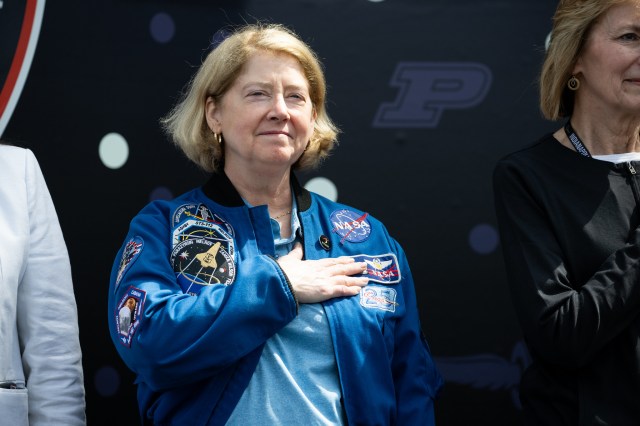 NASA Deputy Administrator Pam Melroy is seen as the National Anthem is performed during opening ceremonies at the Indianapolis Motor Speedway ahead of the total solar eclipse, Monday, April 8, 2024, in Indianapolis, Indiana