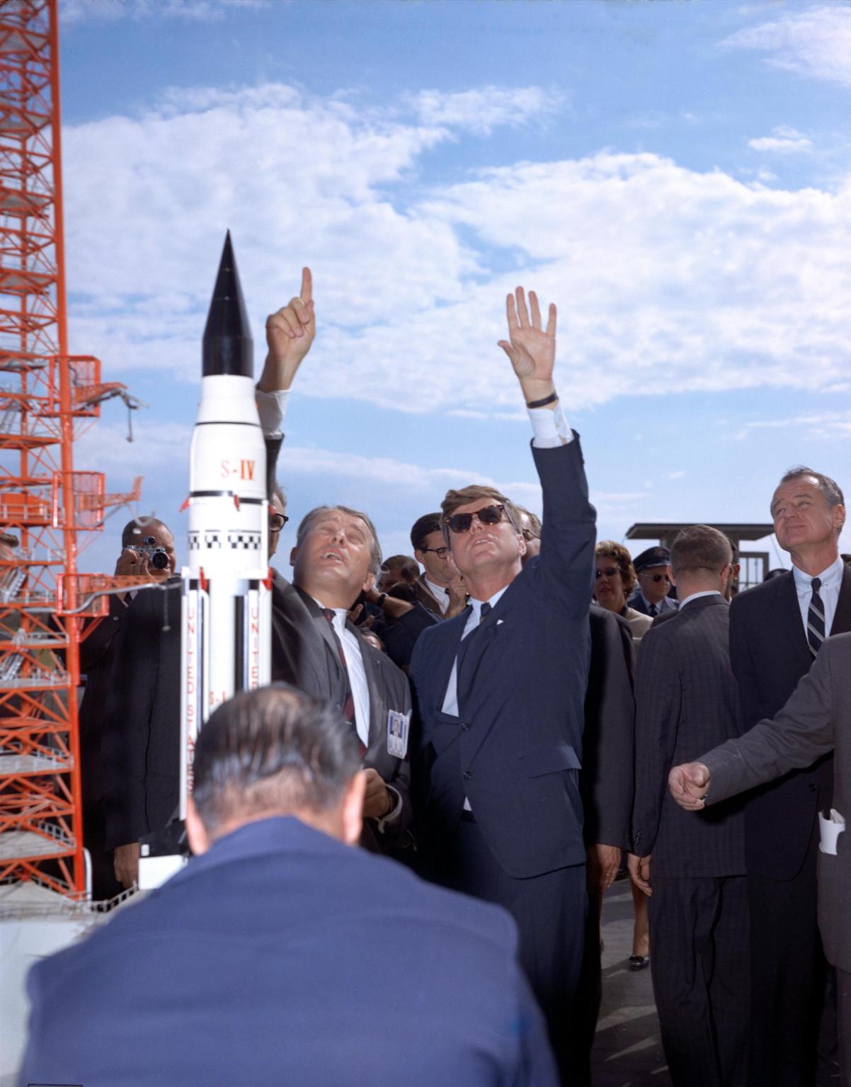 Wernher von Braun explains the Saturn system to President John F. Kennedy at Launch Complex 37 while the president tours the Cape Canaveral Missile Test Annex in 1963.
