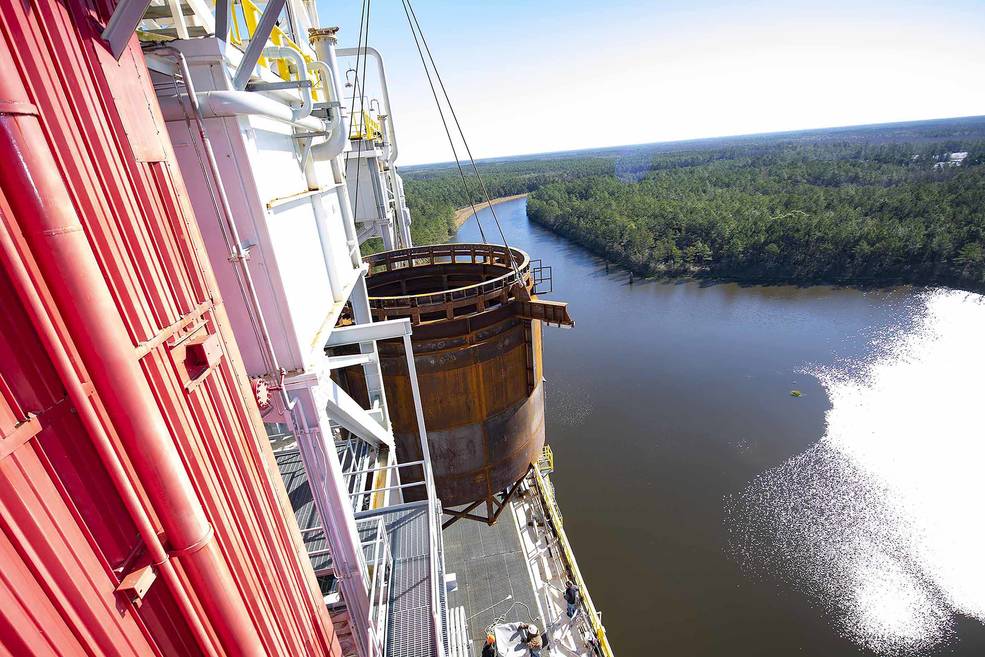 Crews at NASA's Stennis Space Center, near Bay St. Louis, Mississippi, lift the 75-ton interstage simulator test component into place at the B-2 Test Stand