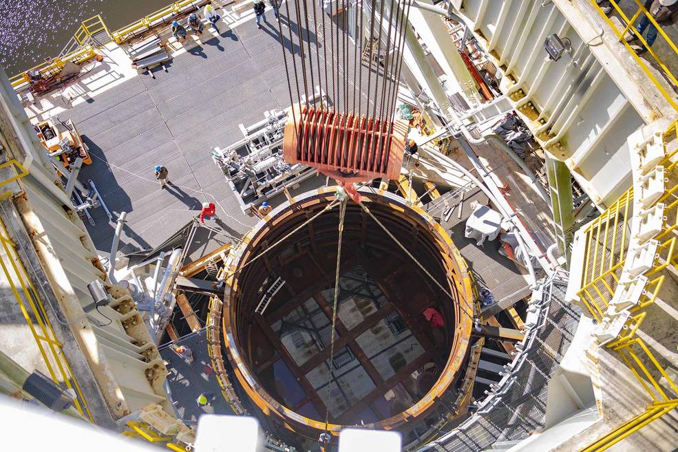 Crews at NASA's Stennis Space Center, near Bay St. Louis, Mississippi, lift the 75-ton interstage simulator test component into place at the B-2 Test Stand