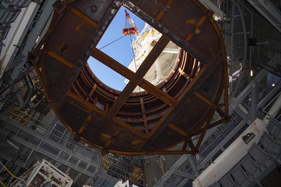 Crews at NASA's Stennis Space Center, near Bay St. Louis, Mississippi, lift the 75-ton interstage simulator test component into place at the B-2 Test Stand