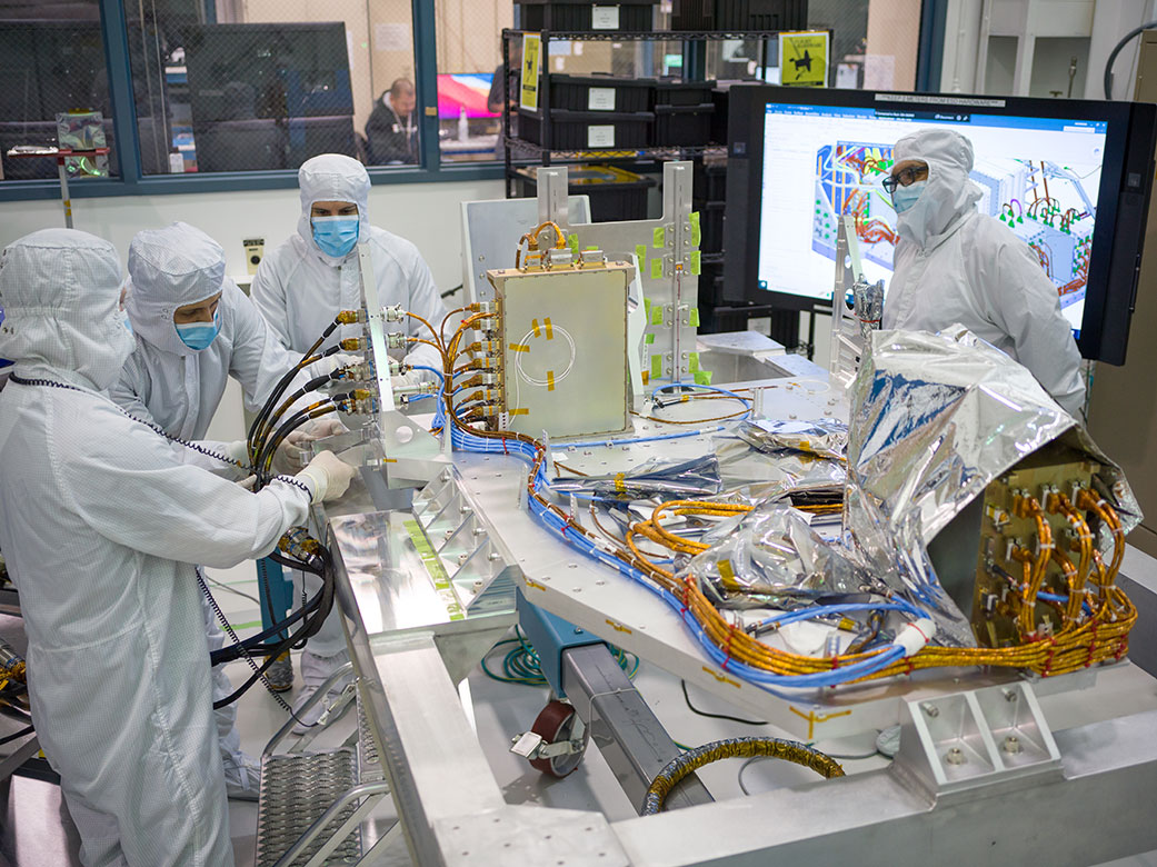 Engineers at NASA’s Jet Propulsion Laboratory are shown assembling the electrical palette for the Coronagraph Instrument