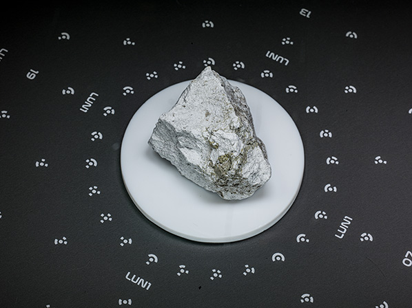 Lunar Sample 60025 is truly an elder amongst the Apollo Lunar Sample Collection. Classified as a Ferroan Anorthosite and dated to be around 4.4 billion years old, it is one of the oldest rocks brought back from the Moon. 