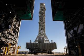 A view from inside the Vehicle Assembly Building (VAB) at NASA's Kennedy Space Center in Florida on Dec. 9, 2022, as the mobile launcher, carried atop the crawler-transporter 2, arrives at the entrance to the transfer aisle.