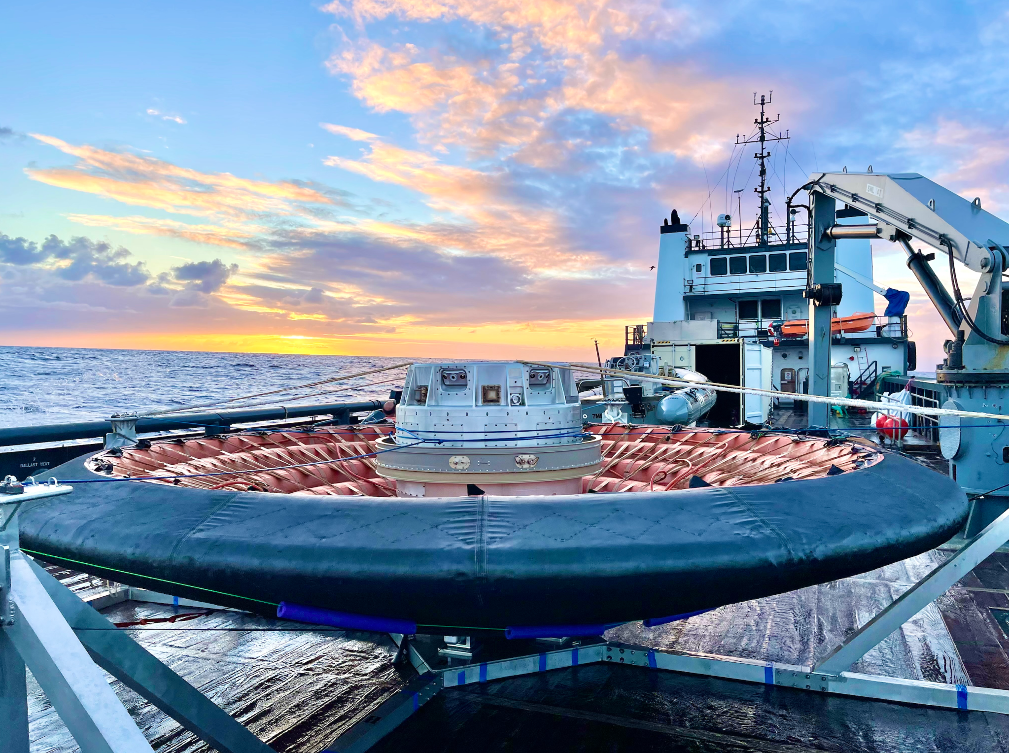 The Low-Earth Orbit Flight Test of an Inflatable Decelerator, or LOFTID, heat shield rests on the deck of the recovery boat after it splashed down and was retrieved from the Pacific Ocean.