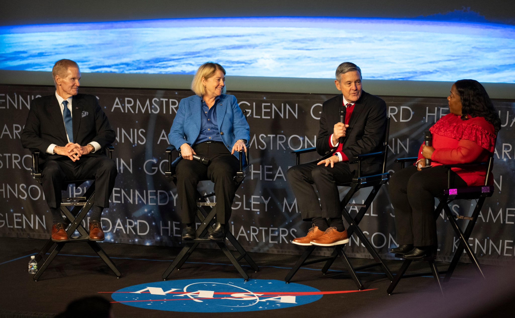 NASA Administrator Bill Nelson, left, Deputy Administrator Pam Melroy, second from left, Associate Administrator Bob Cabana, second from right, and Michelle Jones of Communications, right, on stage at all hands at NASA Headquarters in Washington.