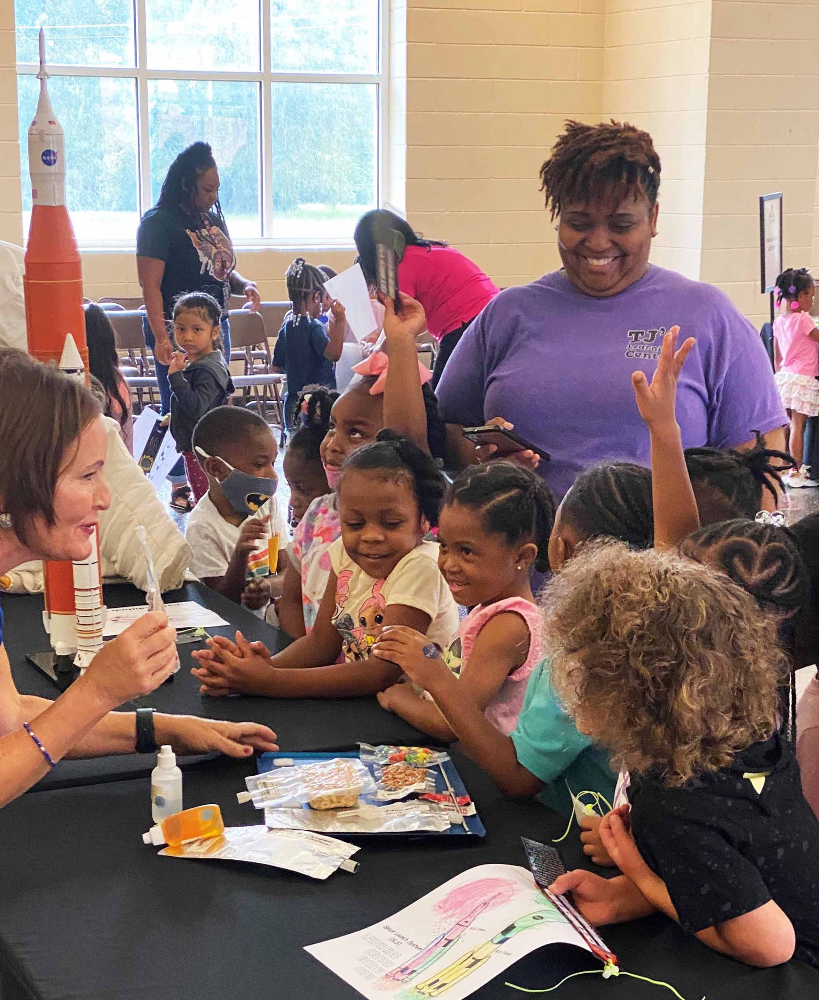 A representative from NASA’s Stennis Space Center teaches pre-K students at the Hattiesburg Early Learning Collaborative about life in space during a site outreach activity