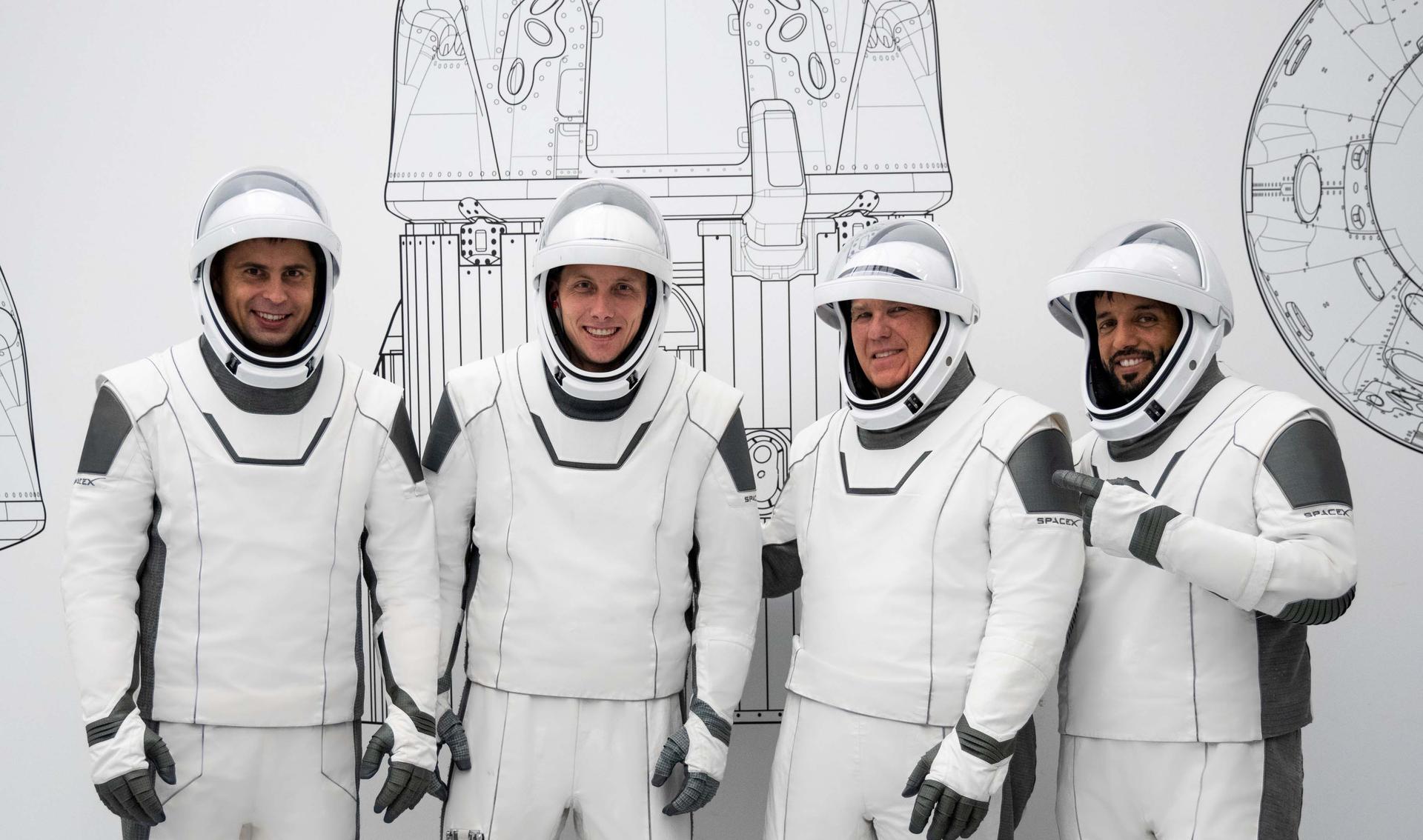 From left, Mission Specialist Andrey Fedyaev, Pilot Warren u0022Woodyu0022 Hoburg, Commander Stephen Bowen, and Mission Specialist Sultan Al Neyadi pose in their SpaceX spacesuits.