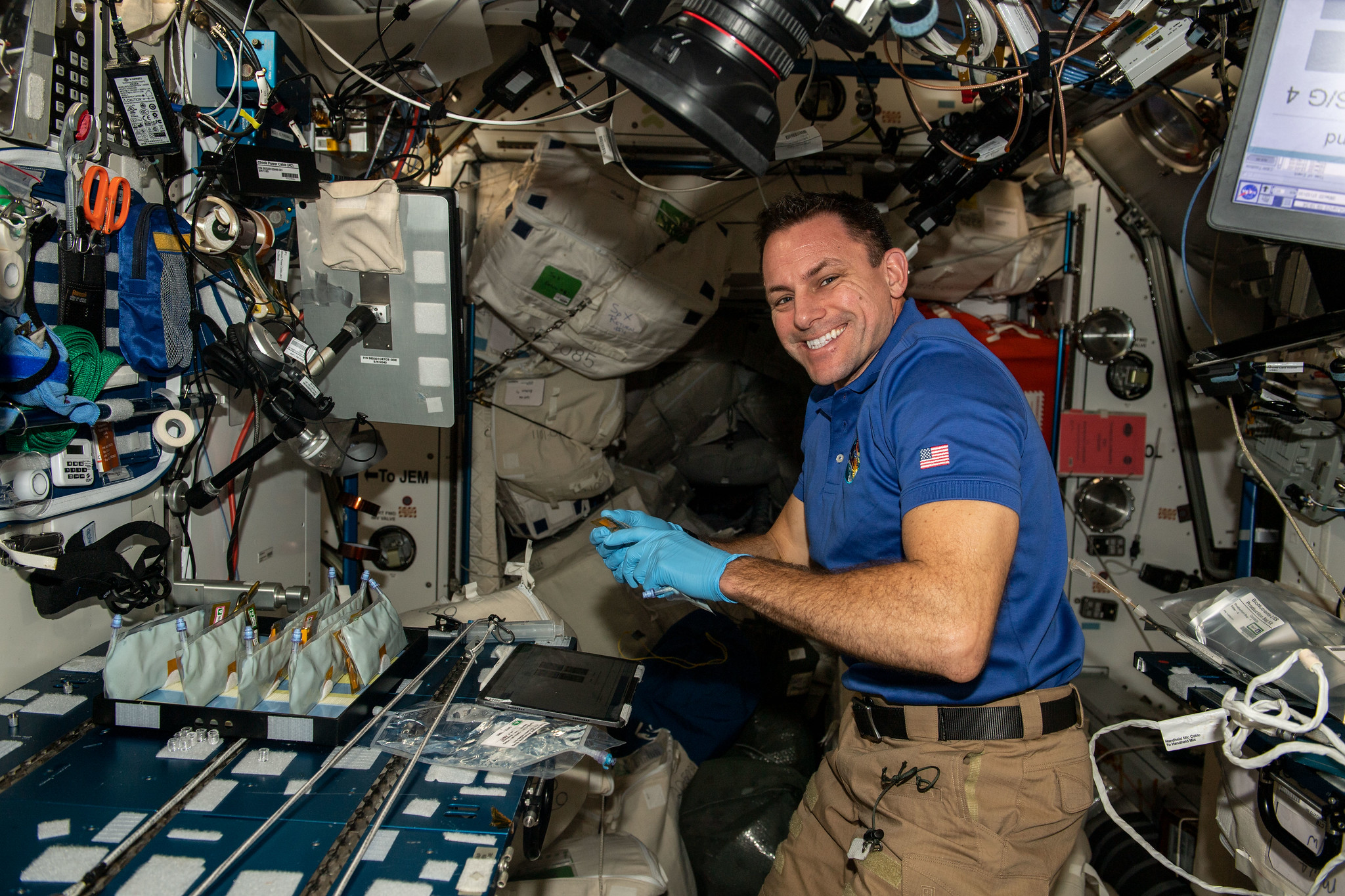 image of an astronaut working with an experiment