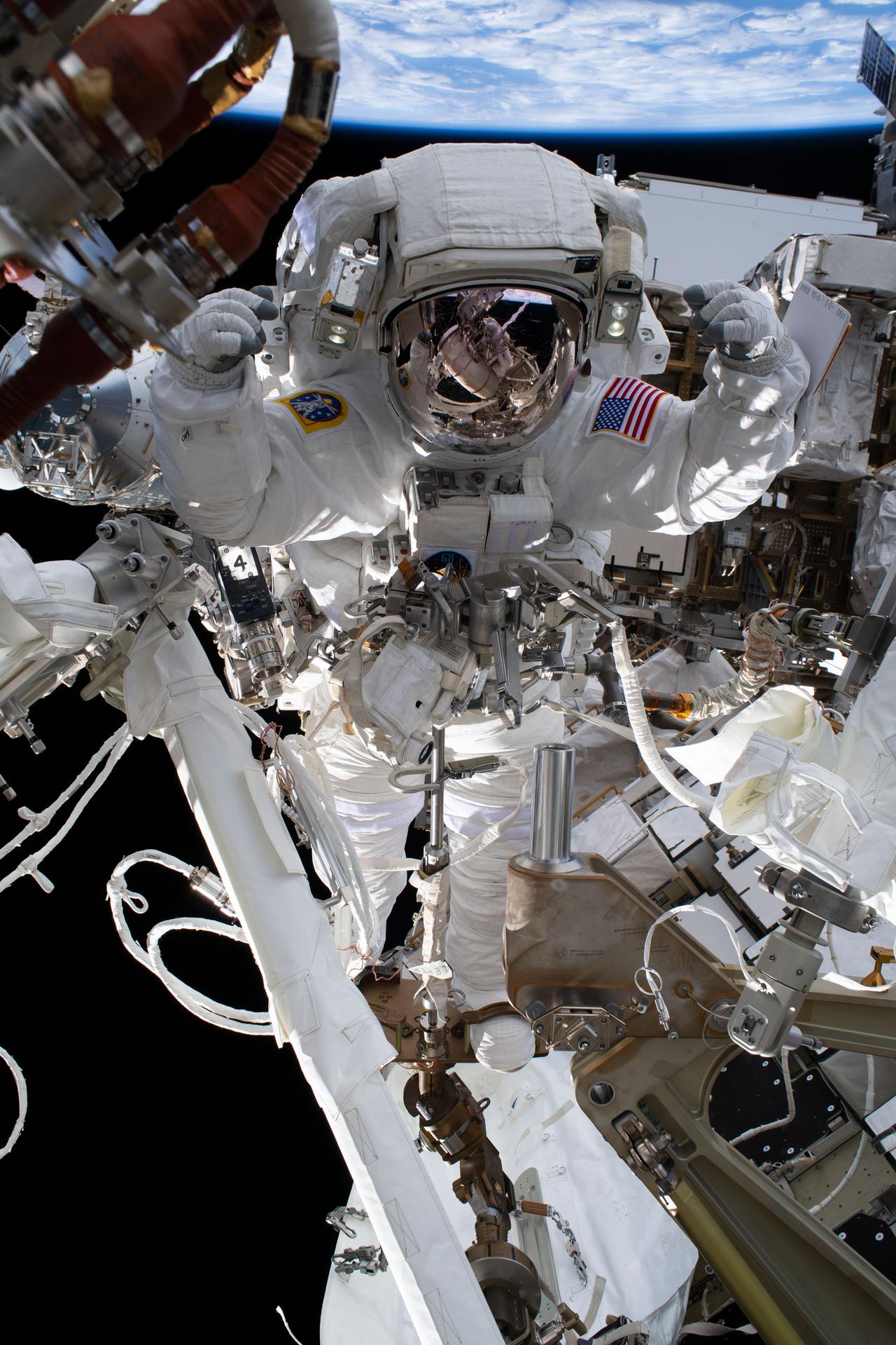 image of an astronaut working during a spacewalk