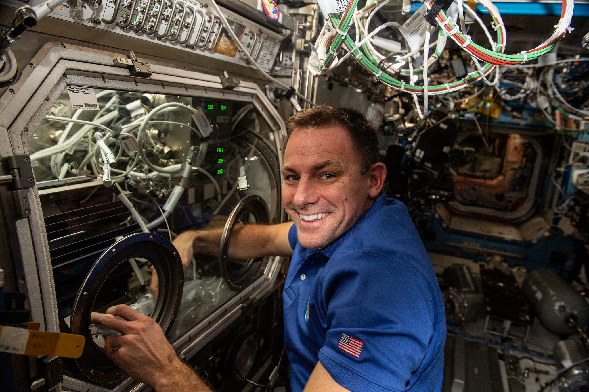 image of an astronaut working with an experiment