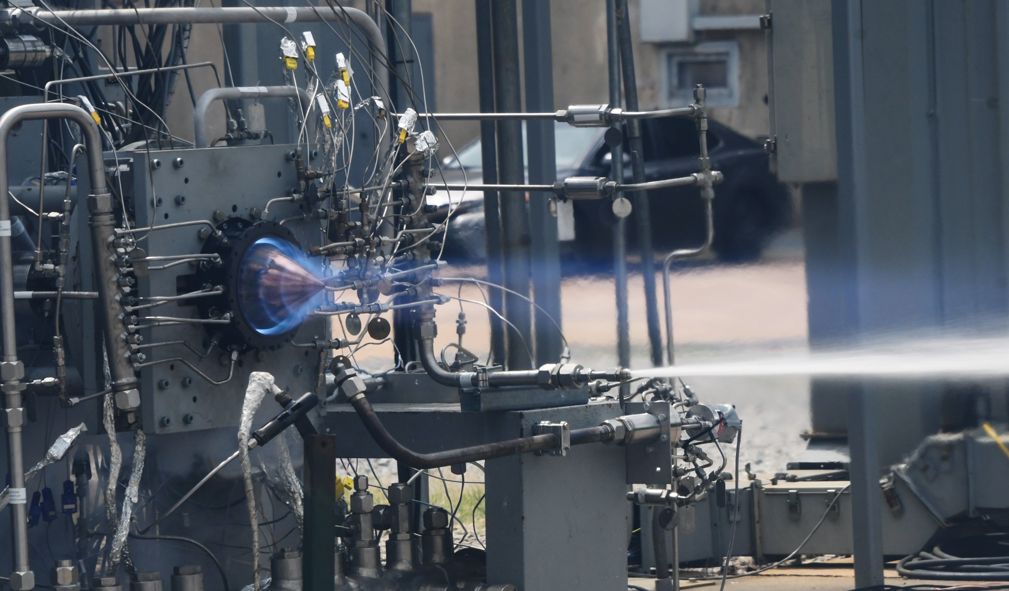 An engine test with almost white to blue stream of propulsion fire 