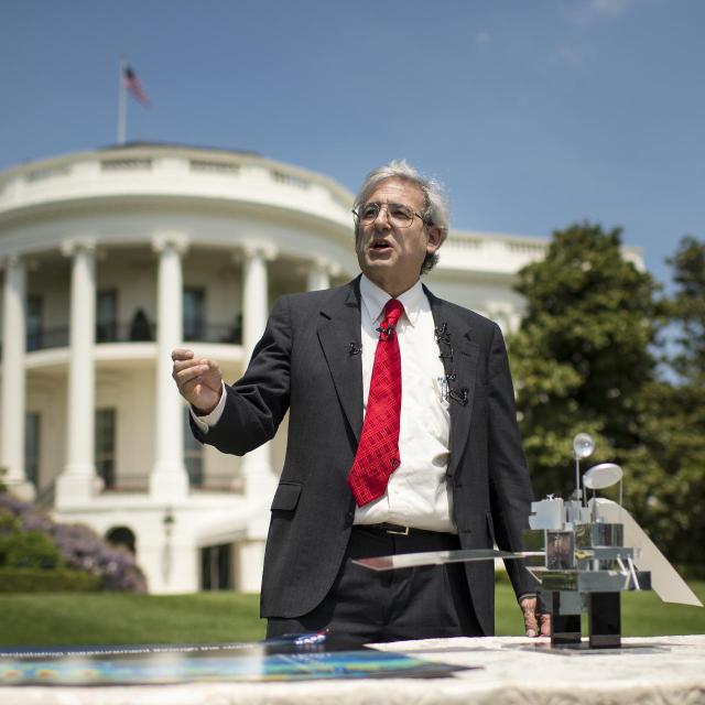 NASA Earth Science Division Director Michael Freilich shows meteorologists a model of the Global Precipitation Measurement (GPM) Core Observatory during a media event for the release of the Third U.S. National Climate Assessment, South Lawn of the White House in Washington, Tuesday, May 6, 2014. NASA Earth-observing satellite observations and analysis by the NASA-supported research community underlie many of the findings in the new climate change assessment. Photo Credit: (NASA/Bill Ingalls)