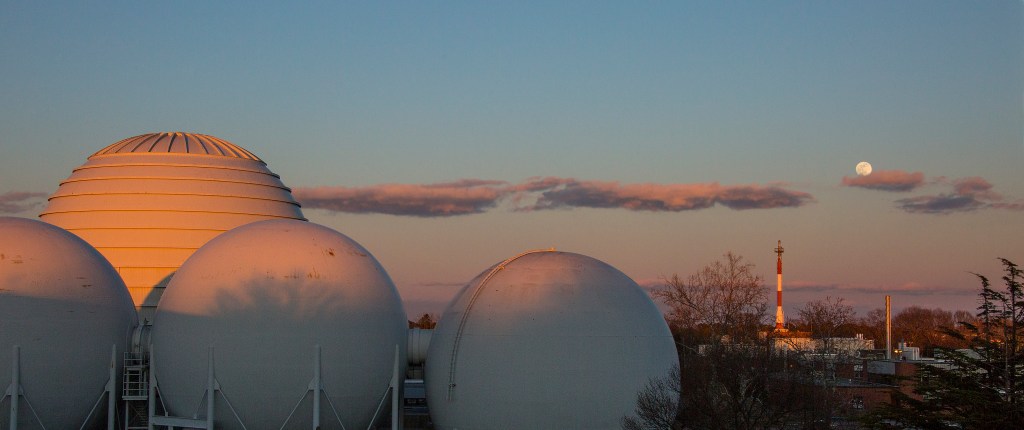 This is a photo of a Blue Moon appearing over NASA Langley's wind tunnels.