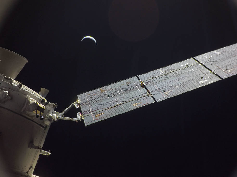 The Orion spacecraft photo of itself with the moon in the distance.