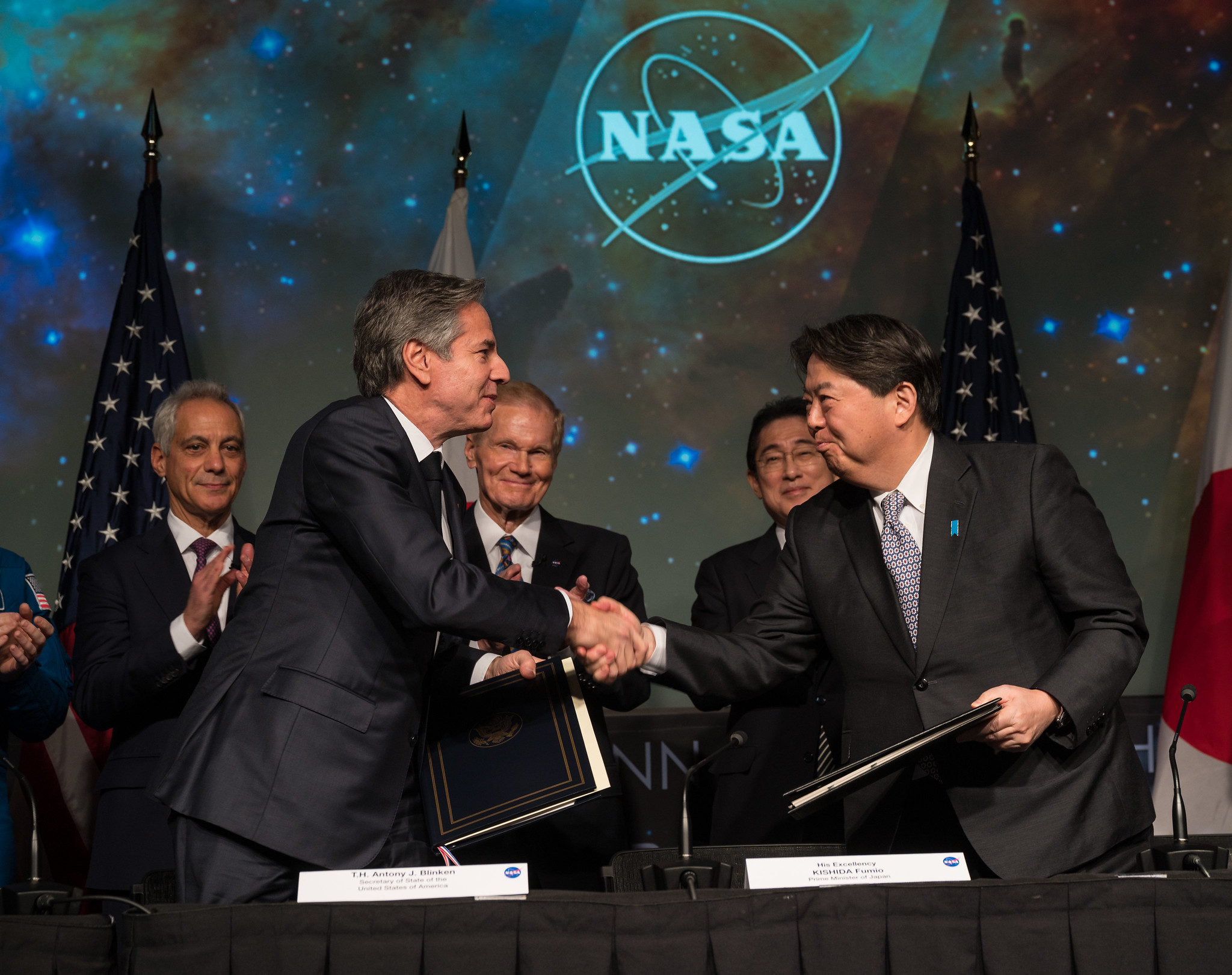U.S. Secretary of State Antony Blinken, front left, and Japan’s Minister for Foreign Affairs, Hayashi Yoshimasa, front right, shake hands after signing an agreement Friday, Jan. 13, 2023. 