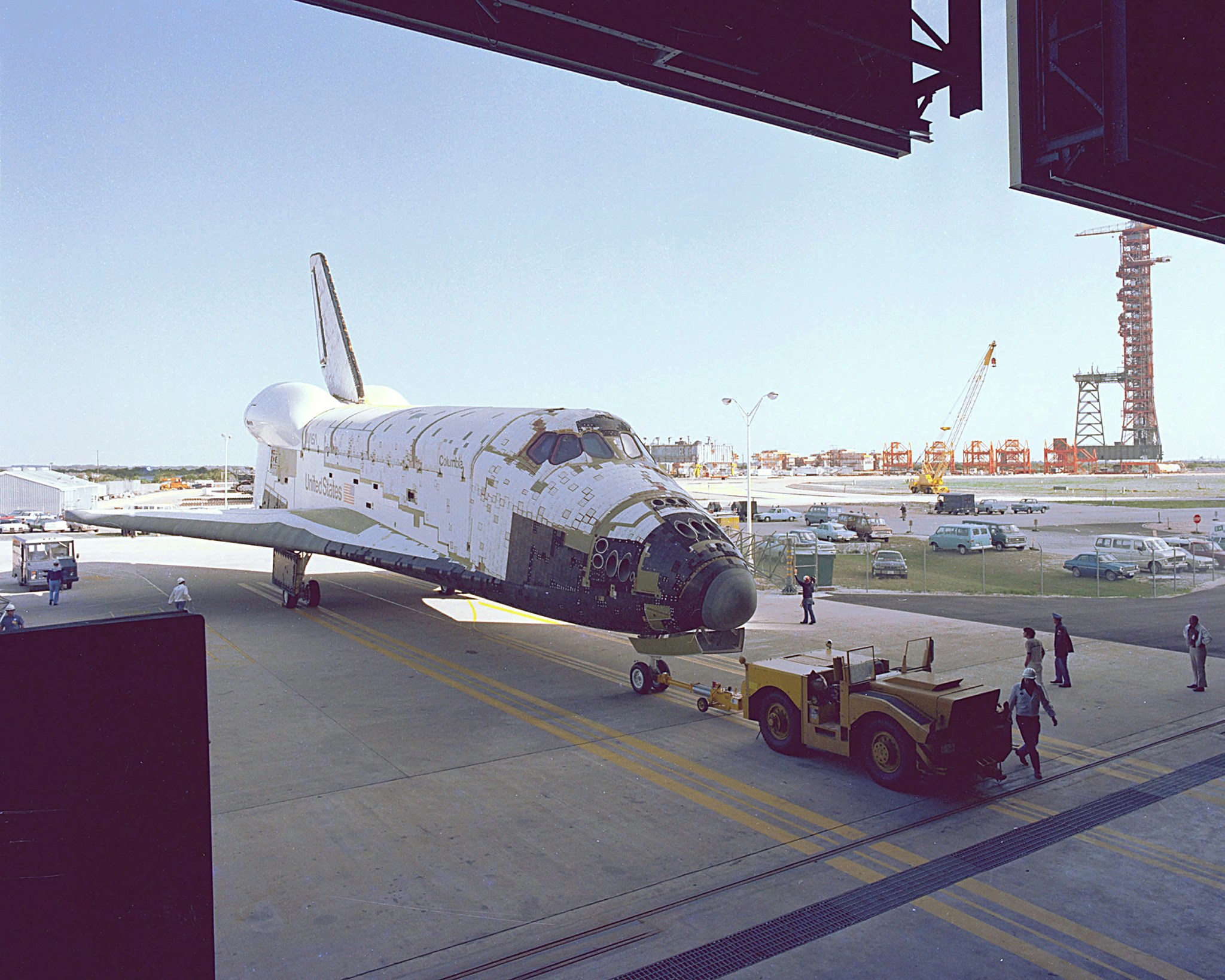 Space Shuttle Columbia is towed into an orbiter processing facility in 1979.