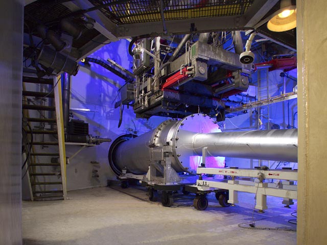 Dramatically lit in blue Direct connect configuration of the interior of the Hypersonic Tunnel Facility (HTF).