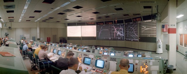 Photo of people working at Mission Control Center