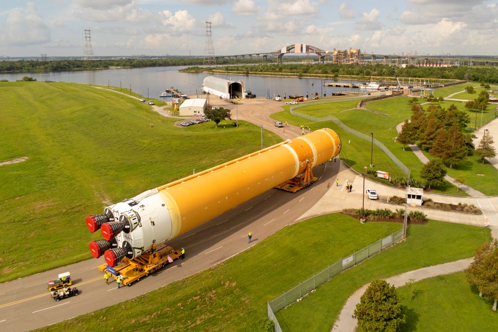 The Artemis II Core Stage rolls out of the Vertical Assembly Building to the waiting Pegasus barge at NASA’s Michoud Assembly Facility in New Orleans in preparation for delivery to Kennedy Space Center.