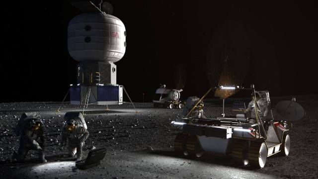 Artist's concept of four Astronauts on a Moon with two vehicles.