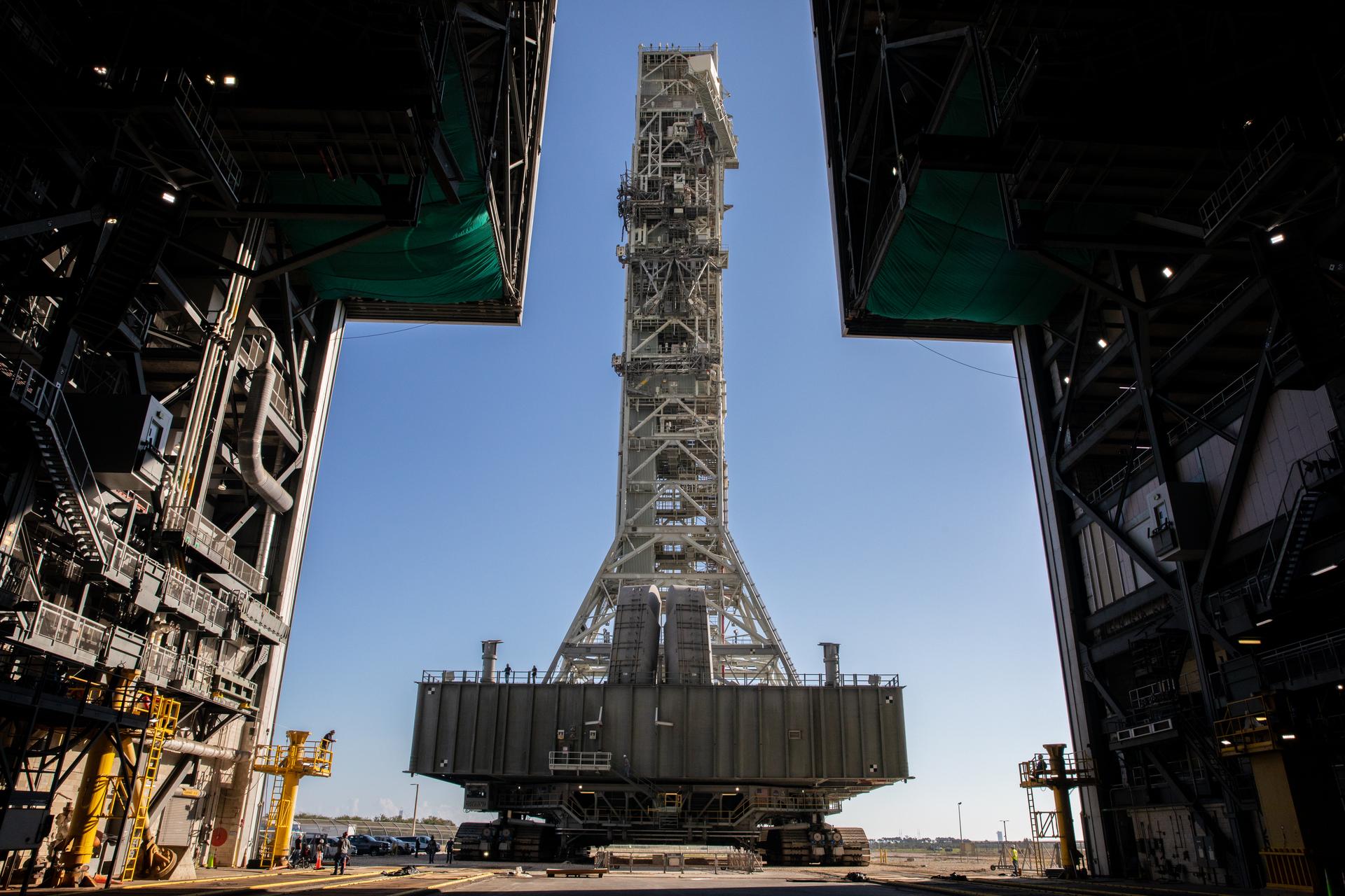 A view from inside the Vehicle Assembly Building (VAB) at NASA’s Kennedy Space Center in Florida on Dec. 9, 2022, as the mobile launcher, carried atop the crawler-transporter 2, arrives at the entrance to the transfer aisle.