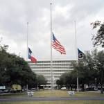 Flags fly at half staff at Johnson Space Center in 2003