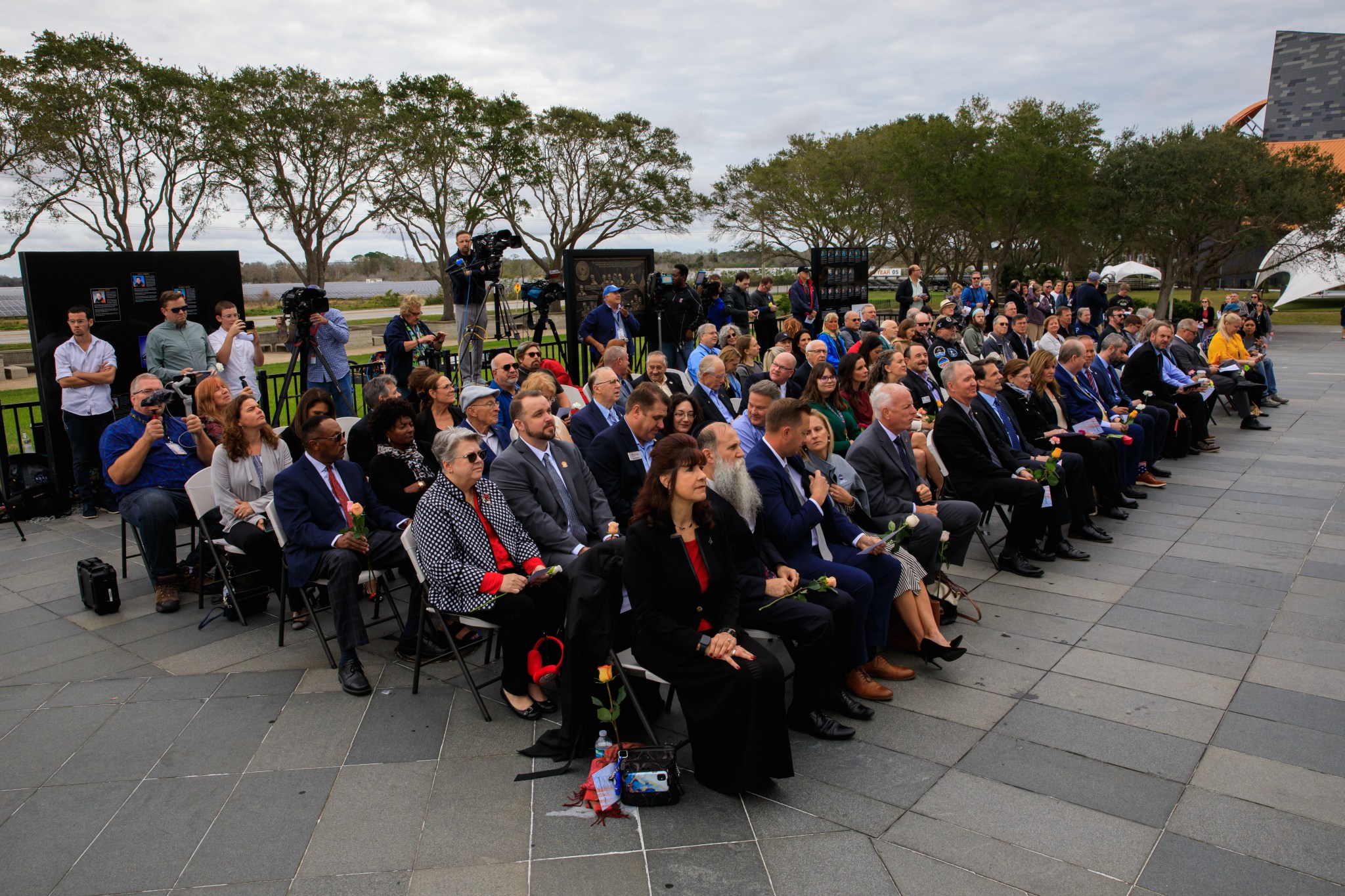 Kennedy Space Center workers and guests attend the Day of Remembrance at the Kennedy Space Center Visitor Complex in Florida on Jan. 26, 2023.