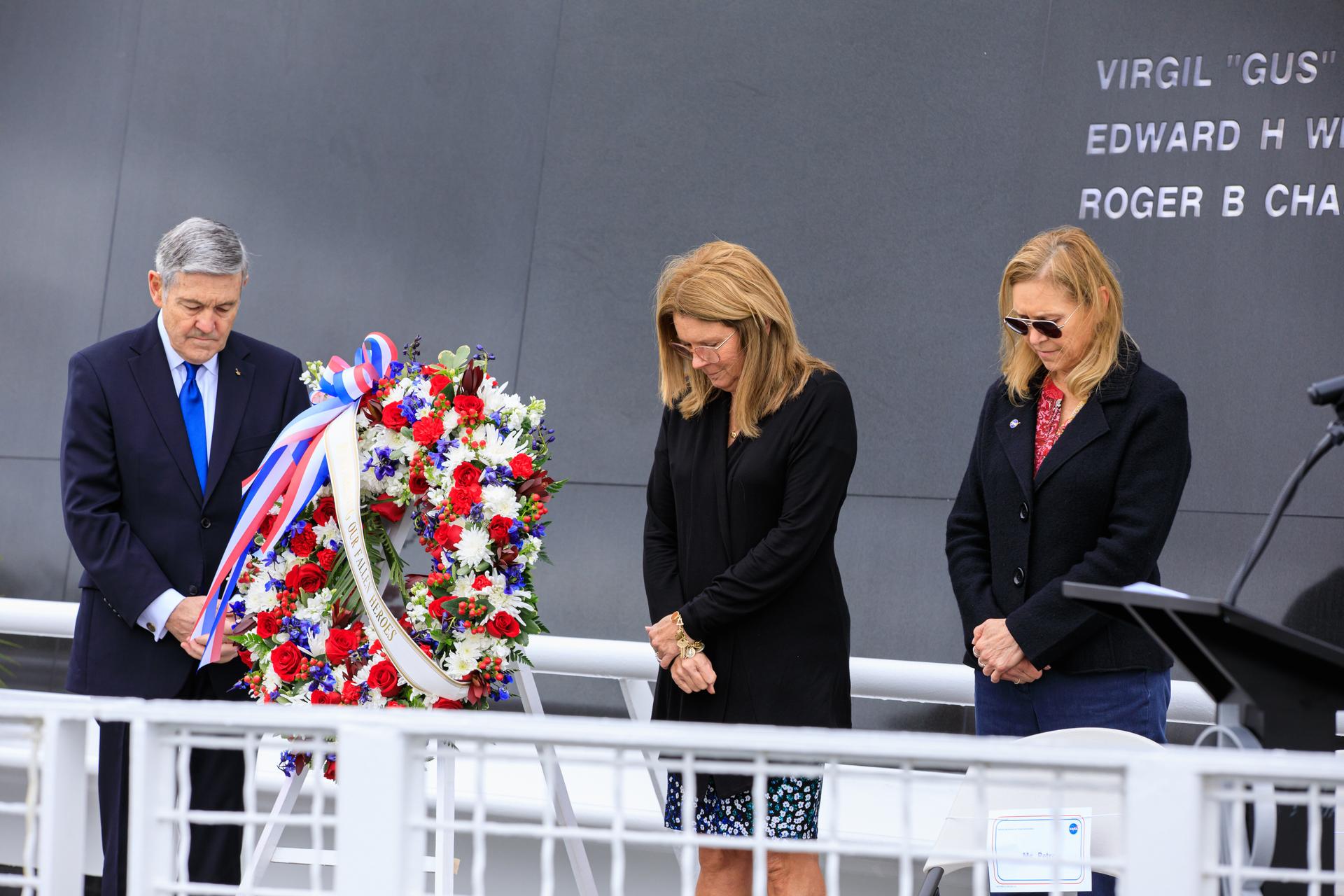 A wreath is placed at the Space Mirror Memorial during the Day of Remembrance ceremony at the Kennedy Space Center Visitor Complex in Florida on Jan. 26, 2023. 