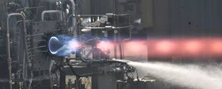 A engine with red fire during a hot fire test.