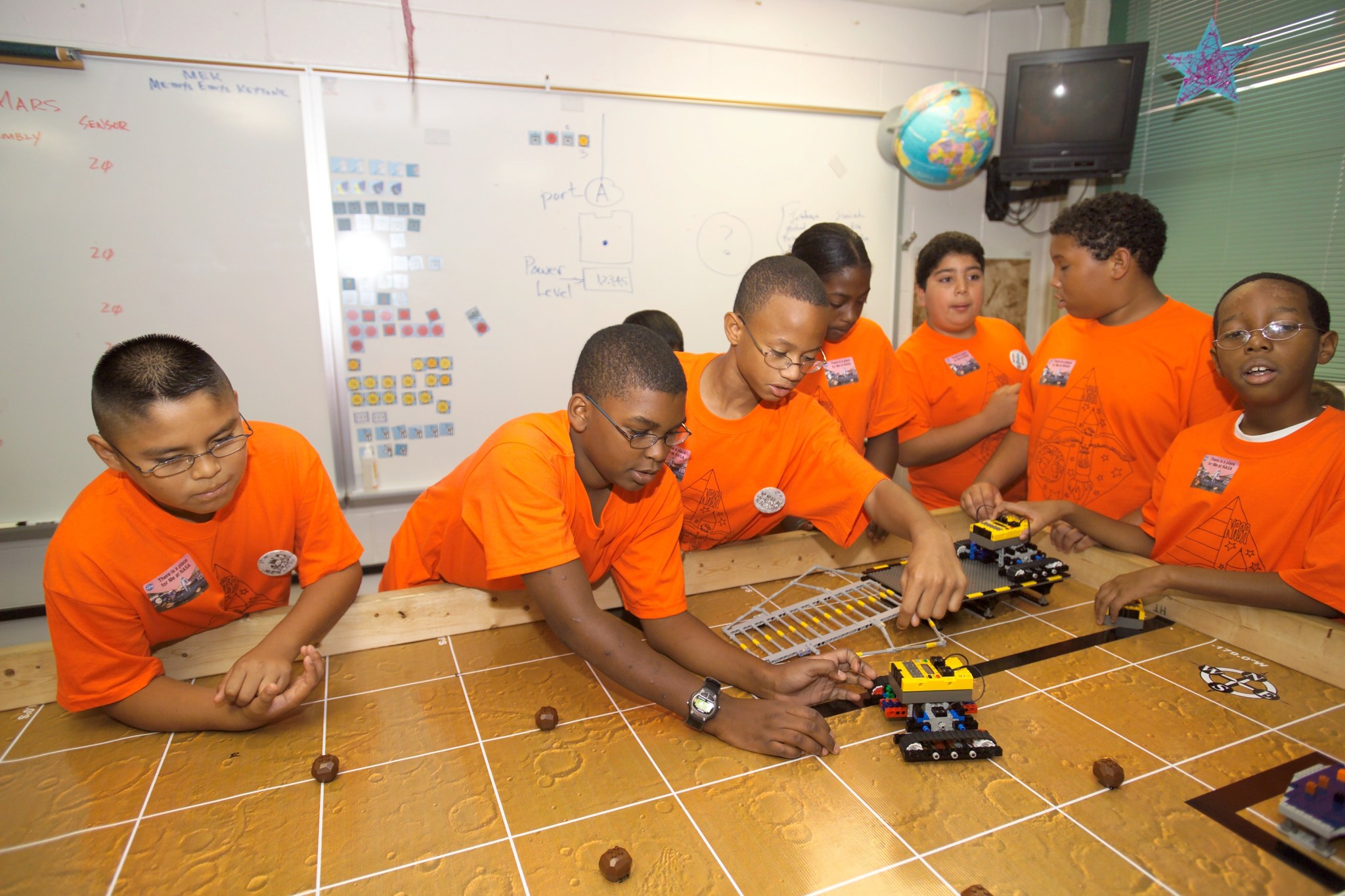 A group of students working on a mars robotics activity
