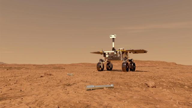 This illustration shows a concept of what a rover fetching rock and soil samples on Mars for return to Earth could look like. The sample tube in this image would have been left on the surface by a previous mission, NASA's Mars 2020 rover.
