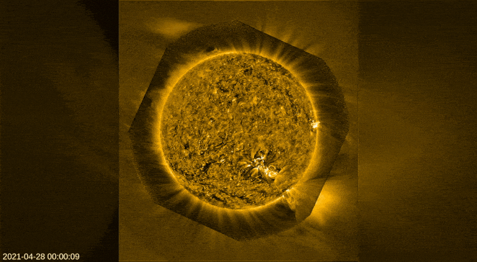 In the center, a gold, rotating Sun. Gold and black swirls across the surface of the Sun. Around the edges, streams of golden solar particles escape the star, into space.