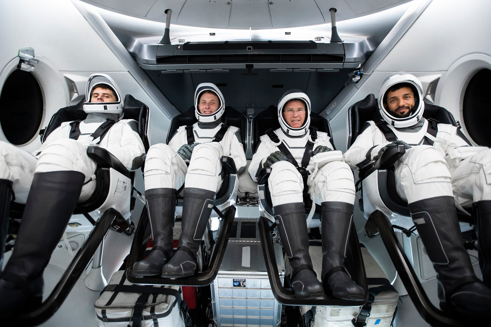 Seated from left in their spacesuits are, Mission Specialist Andrey Fedyaev, Pilot Warren u0022Woodyu0022 Hoburg, Commander Stephen Bowen, and Mission Specialist Sultan Alneyadi.